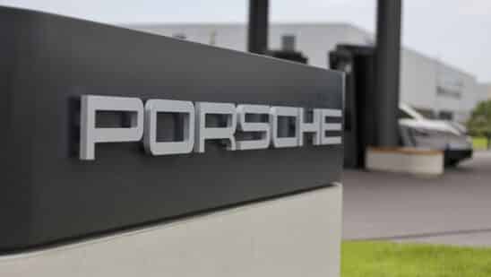 A sign at the Porsche AG first worldwide electric vehicle charging lounge in Bingen, Germany, on Monday, Aug. 28, 2023. The first Porsche Charging Lounge in the world is heated and air-conditioned by a heat pump that operates without fossil fuels, according to their press release. Photographer: Alex Kraus/Bloomberg