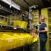 An employee scans an item at a fulfillment center in Robbinsville, New Jersey. Photographer: Bess Adler/Bloomberg