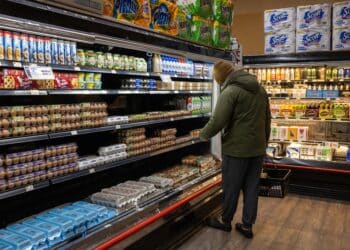 A shopper picks up eggs at a grocery store in New York, US, on Wednesday, Feb. 12, 2025. With bird flu killing millions of egg-laying chickens, prices surged more than 15% in January from a month earlier, the biggest advance since 2015, and 55% from a year before, according to a US Bureau of Labor Statistics report on Wednesday. Photographer: Yuki Iwamura/Bloomberg