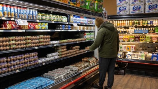 A shopper picks up eggs at a grocery store in New York, US, on Wednesday, Feb. 12, 2025. With bird flu killing millions of egg-laying chickens, prices surged more than 15% in January from a month earlier, the biggest advance since 2015, and 55% from a year before, according to a US Bureau of Labor Statistics report on Wednesday. Photographer: Yuki Iwamura/Bloomberg