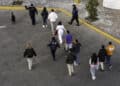 Mexican immigration officials and police escort deportees in Nogales, Arizona, on Jan. 22.