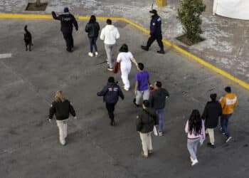 Mexican immigration officials and police escort deportees in Nogales, Arizona, on Jan. 22.
