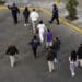 Mexican immigration officials and police escort deportees in Nogales, Arizona, on Jan. 22.
