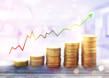 funds growth concept coins stacked higher and higher with arrow up