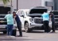 Customers look at vehicles for sale at a GMC Chevrolet dealership in Yuma, Arizona, US, on Monday, March 31, 2025. Whether Donald Trump's 25% tariffs on imported vehicles achieve the president's goal of revitalizing domestic auto manufacturing remains to be seen, but the levies that start April 3 are almost certain to push up the prices of new models if they stay in force for more than a few months.