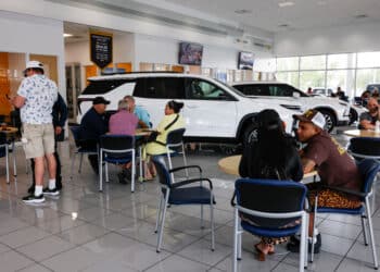 Customers at a dealership in Miami, Florida. Photographer: Eva Marie Uzcategui/Bloomberg