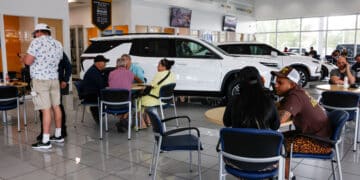 Customers at a dealership in Miami, Florida. Photographer: Eva Marie Uzcategui/Bloomberg