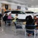 Customers at a dealership in Miami, Florida. Photographer: Eva Marie Uzcategui/Bloomberg