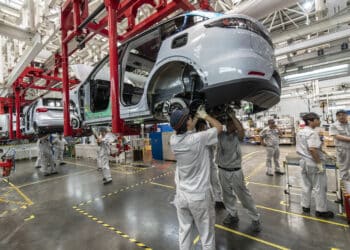 Workers on the assembly line at the Zhejiang Leapmotor Technology Co. production facility in Jinhua, Zhejiang province, China, on Sunday, June 23, 2024. Chinese electric car maker Leapmotor is little known outside its home country, and even there it is overshadowed by bigger players like BYD Co. and Tesla Inc. Photographer: Qilai Shen/Bloomberg