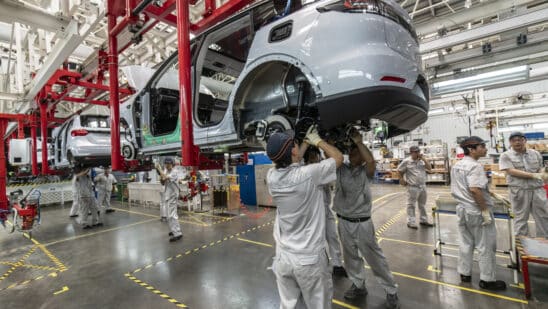 Workers on the assembly line at the Zhejiang Leapmotor Technology Co. production facility in Jinhua, Zhejiang province, China, on Sunday, June 23, 2024. Chinese electric car maker Leapmotor is little known outside its home country, and even there it is overshadowed by bigger players like BYD Co. and Tesla Inc. Photographer: Qilai Shen/Bloomberg