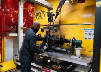Worker prepares an axle for welding at the Dana Inc. Toledo Driveline Facility, Toledo, Ohio, Oct 5, 2021. Photographer:Dane Rhys/Bloomberg