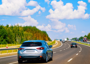 Cars on road on sunny day