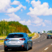 Cars on road on sunny day