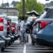 Customers at a car dealership in Richmond, California.