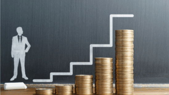 salary increase concept businesman steps higher stacks coins
