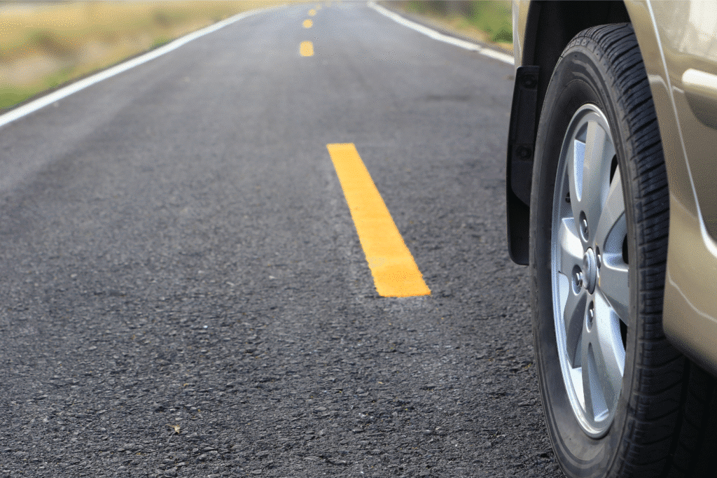 close up of car wheel on road
