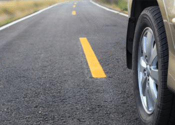 close up of car wheel on road