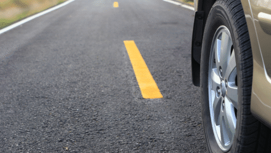 close up of car wheel on road