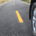 close up of car wheel on road