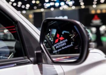 The Mitsubishi Motors logo is seen in the sideview mirror or a Pajero Sport on display at the Bangkok Motor Show in Bangkok, Thailand, on Monday, March 25, 2024. Photographer: Andre Malerba/Bloomberg