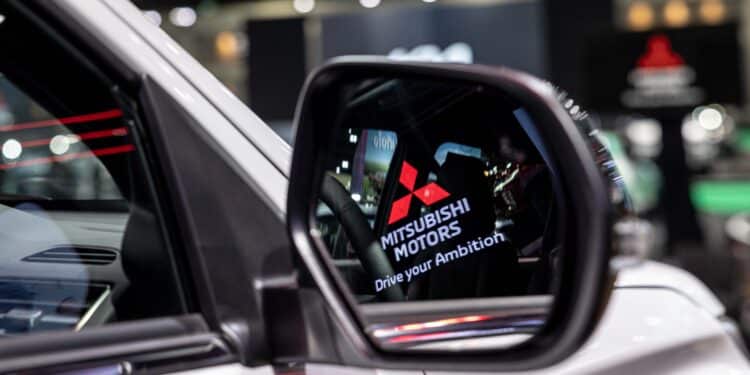 The Mitsubishi Motors logo is seen in the sideview mirror or a Pajero Sport on display at the Bangkok Motor Show in Bangkok, Thailand, on Monday, March 25, 2024. Photographer: Andre Malerba/Bloomberg