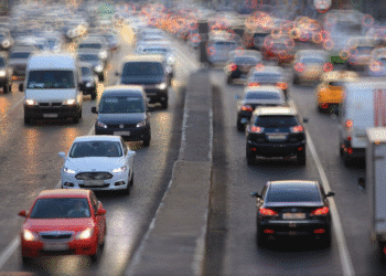 cars on road with blurry background of headlights
