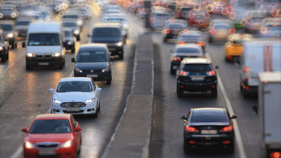 cars on road with blurry background of headlights