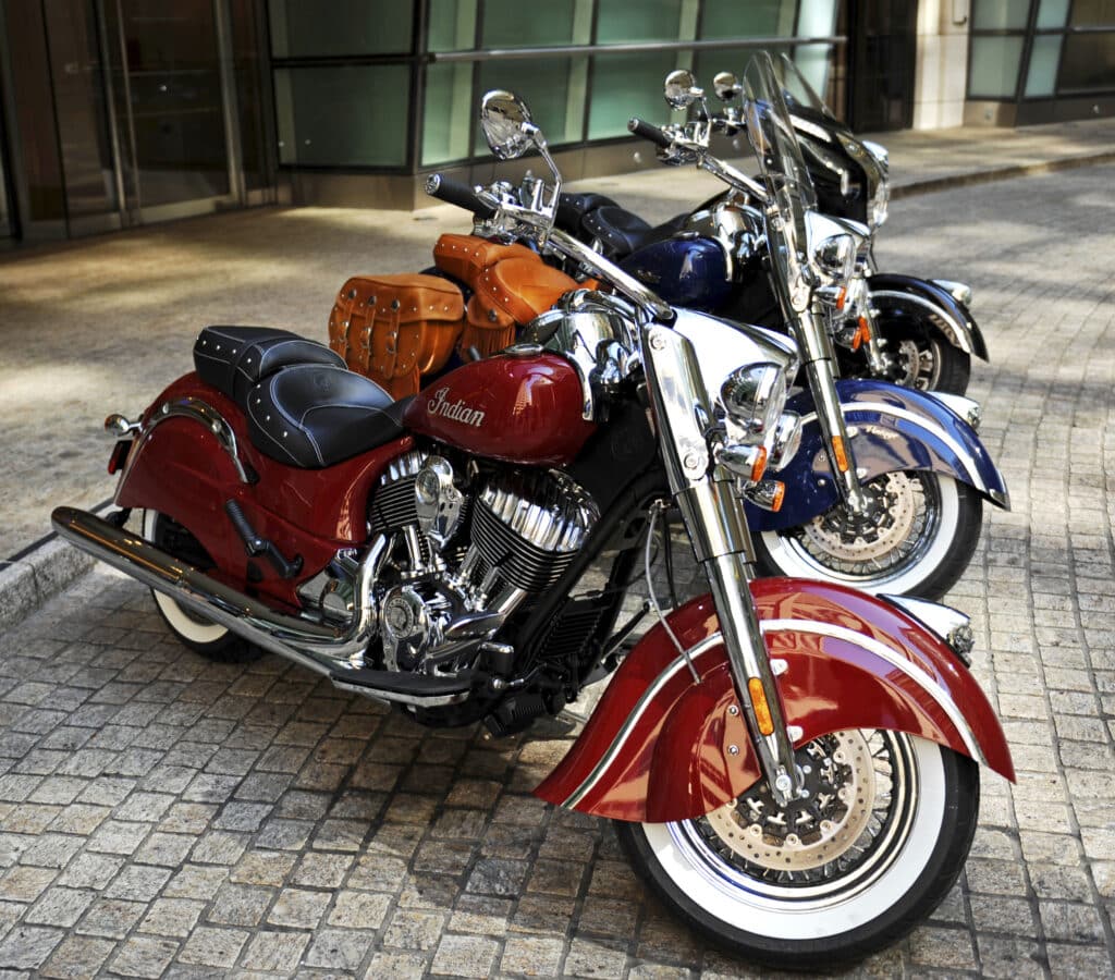 The new line of Indian Motorcycle Co. 2014 Indian Chief motorcycles are displayed for a photograph in New York, U.S., on Monday, Aug. 5, 2013. The Chief Classic in red sits in front of the Chief Vintage in blue and the Chieftan in black. Indian Motorcycle Co., a subsidiary of Polaris Industries Inc., announced today the details for the new 2014 Indian Chief family of motorcycles. Photographer: Peter Foley/Bloomberg