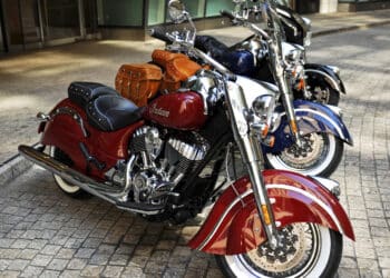 The new line of Indian Motorcycle Co. 2014 Indian Chief motorcycles are displayed for a photograph in New York, U.S., on Monday, Aug. 5, 2013. The Chief Classic in red sits in front of the Chief Vintage in blue and the Chieftan in black. Indian Motorcycle Co., a subsidiary of Polaris Industries Inc., announced today the details for the new 2014 Indian Chief family of motorcycles. Photographer: Peter Foley/Bloomberg