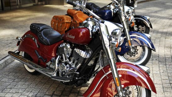 The new line of Indian Motorcycle Co. 2014 Indian Chief motorcycles are displayed for a photograph in New York, U.S., on Monday, Aug. 5, 2013. The Chief Classic in red sits in front of the Chief Vintage in blue and the Chieftan in black. Indian Motorcycle Co., a subsidiary of Polaris Industries Inc., announced today the details for the new 2014 Indian Chief family of motorcycles. Photographer: Peter Foley/Bloomberg