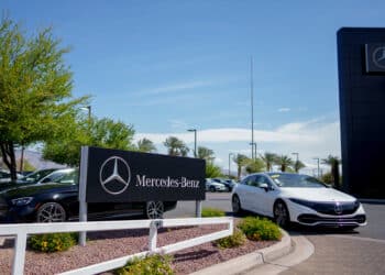 A Mercedes-Benz EQS electric vehicle at a Mercedes-Benz dealership in Tucson, Arizona.