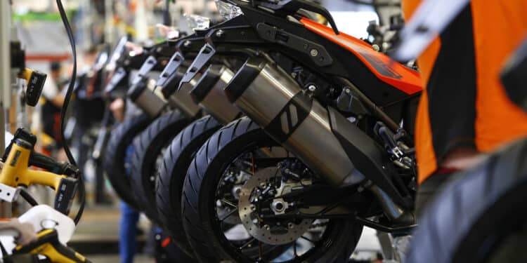 Partly-assembled KTM 1290 super adventure motorcycles sit on the assembly line inside the KTM-Sportmotorcycle AG motorcycle manufacturing facility in Mattighofen, Austria, on Monday, April 29, 2019. As Austria emerged from the rubble of World War II, KTM churned out inexpensive, durable two-wheelers to help a broken nation hit the road again. Photographer: Michaela Handrek-Rehle/Bloomberg