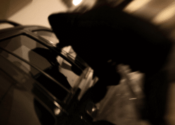 person trying to steal car silhouette
