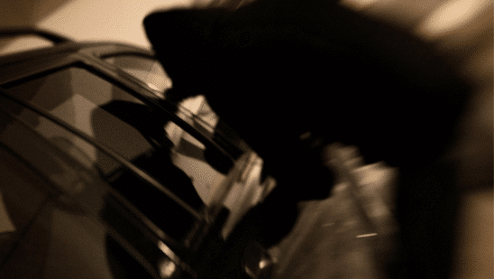 person trying to steal car silhouette