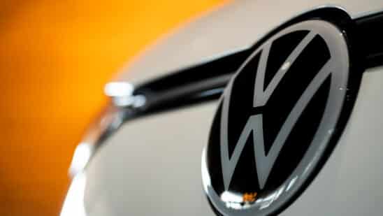 A Volkswagen badge on an electric vehicle at the Everything Electric show in Vancouver, British Columbia, Canada, on Friday, Sept. 5, 2025. Canada announced that it would scrap the 2026 EV sales mandate and launch a regulatory review. Photographer: Paige Taylor White/Bloomberg