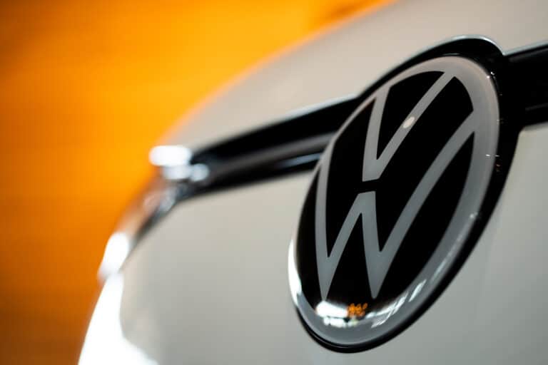 A Volkswagen badge on an electric vehicle at the Everything Electric show in Vancouver, British Columbia, Canada, on Friday, Sept. 5, 2025. Canada announced that it would scrap the 2026 EV sales mandate and launch a regulatory review. Photographer: Paige Taylor White/Bloomberg