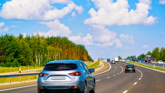 cars on road blue sky fall