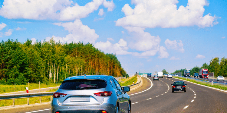 cars on road blue sky fall