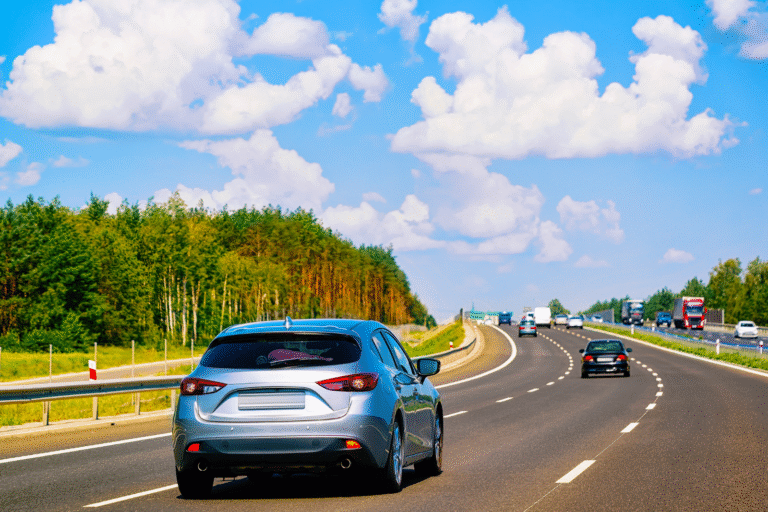 cars on road blue sky fall