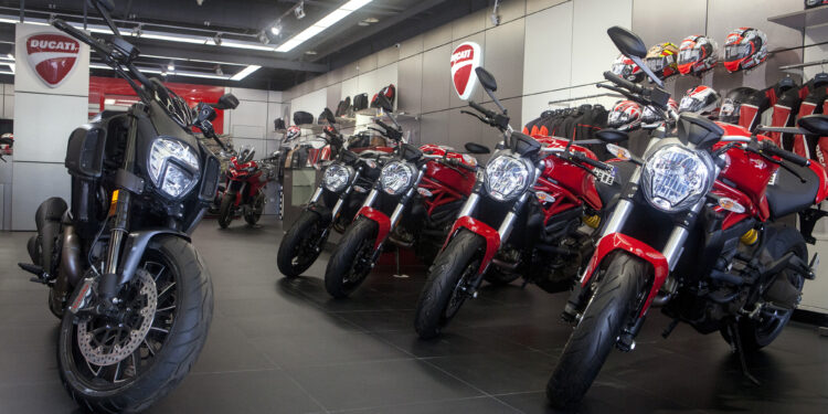 A Ducati Diavel Dark motorcycle, left, stands next to four Ducati Monster 821 motorcycles manufactured by Ducati Motor Holding SpA at the company's showroom in Beijing, China, on Friday, Aug. 5, 2016. With China's motorcycle market in decline, makers of superbikes are adding lighter, sleeker and less powerful models to their offering, trying to appeal to well-heeled novice riders and, especially, women.