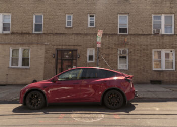 (EDITOR'S NOTE: ONE TIME USE ONLY IN CONNECTION WITH "Short on Curbside Chargers, New York EV Drivers Are Improvising" By Alicia Clanton) Sal Cameli, owner of three electric vehicles, charges his Tesla using a 19-foot cable rigged from his kitchen to his electric car in Jersey City, New Jersey, US, on Friday, May 24, 2024. Electric car owners across the metro area are finding creative workarounds for limited street charging, from DIY setups to policing public plugs.