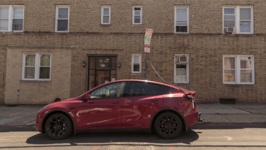 (EDITOR'S NOTE: ONE TIME USE ONLY IN CONNECTION WITH "Short on Curbside Chargers, New York EV Drivers Are Improvising" By Alicia Clanton) Sal Cameli, owner of three electric vehicles, charges his Tesla using a 19-foot cable rigged from his kitchen to his electric car in Jersey City, New Jersey, US, on Friday, May 24, 2024. Electric car owners across the metro area are finding creative workarounds for limited street charging, from DIY setups to policing public plugs.