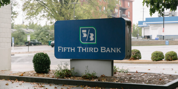 Signage at a Fifth Third Bank branch in Cincinnati, Ohio, US, on Tuesday, Oct. 7, 2025. Fifth Third Bancorp agreed to buy Comerica Inc. for about $10.9 billion in stock, the largest US bank deal this year and a sign that the logjam blocking big mergers in the industry may have broken under the Trump administration's deregulation efforts.