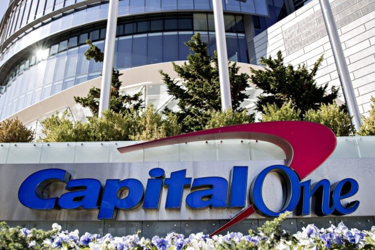 Signage is displayed outside Capital One Financial Corp. headquarters in McLean, Virginia, U.S., on Wednesday, Nov. 6, 2019. Capital One's July 29 disclosure of a data breach exposed the company to regulatory fines and lawsuits, which could cost more than $200 million according to Bloomberg Intelligence. Photographer: Andrew Harrer/Bloomberg