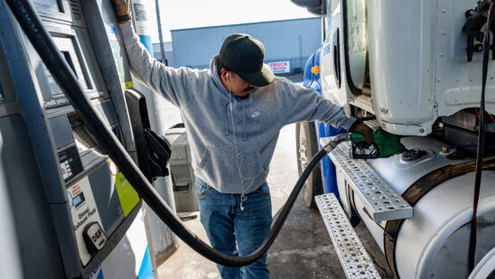A driver refuels a tractor trailer at a truck stop in Tracy, California.