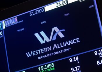 Investor tied to troubled bank loans charged with fraud by US