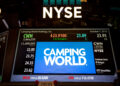 Camping World Holdings Inc. signage is displayed on a monitor on the floor of the New York Stock Exchange (NYSE) in New York, U.S., on Friday, Oct. 7, 2016. U.S. stocks fell after jobs data showing steady growth in the labor market likely kept the Federal Reserve on track to tighten monetary policy this year as investors turn to the third-quarter earnings season.