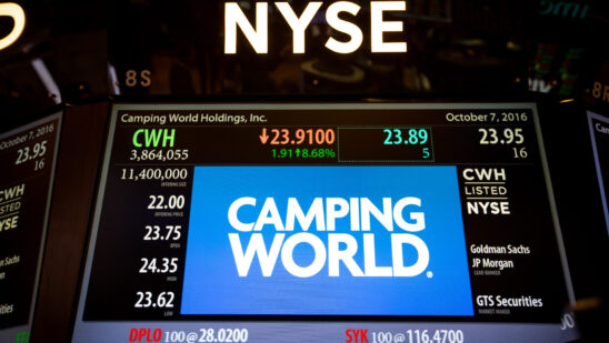 Camping World Holdings Inc. signage is displayed on a monitor on the floor of the New York Stock Exchange (NYSE) in New York, U.S., on Friday, Oct. 7, 2016. U.S. stocks fell after jobs data showing steady growth in the labor market likely kept the Federal Reserve on track to tighten monetary policy this year as investors turn to the third-quarter earnings season.