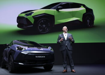 Ivan Espinosa, chief executive officer of Nissan Motor Co., speaks next to a Juke compact crossover SUV at the companys headquarters in Yokohama, Japan, on Tuesday, April 14, 2026. A year after taking charge of ailing automaker, Espinosa has unveiled a makeover to freshen its aging lineup and set ambitious targets to boost US and China sales to levels not seen in years.